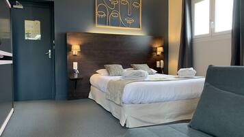 Family Quadruple Room | Minibar, in-room safe, individually decorated, desk