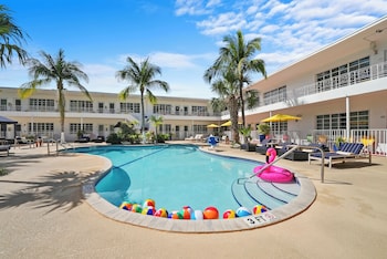 Outdoor pool, free cabanas, pool umbrellas at Tradewinds Apartment Hotel
