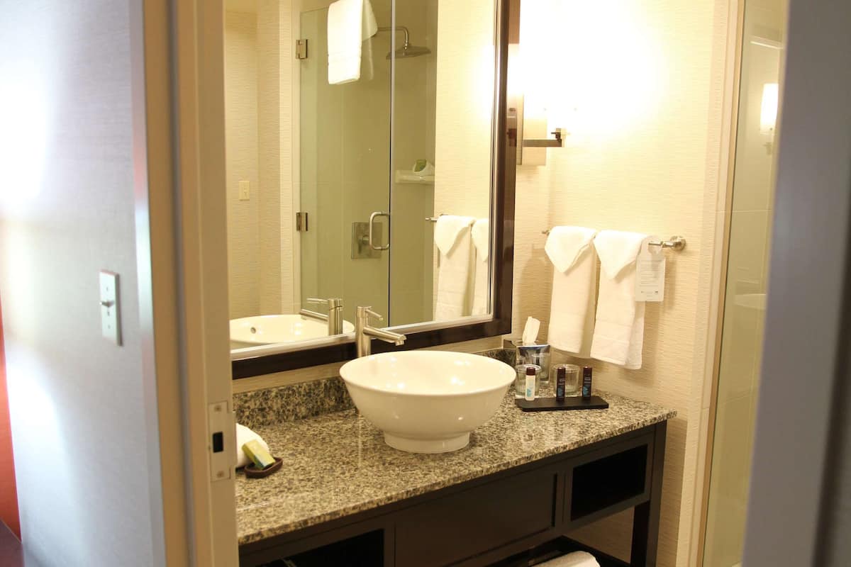 rainfall showerhead, designer toiletries, hair dryer, towels