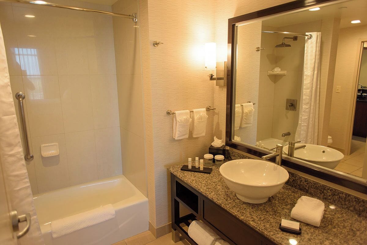 rainfall showerhead, designer toiletries, hair dryer, towels