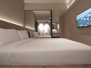 Executive kamer, 1 queensize bed | Luxe beddengoed, een minibar, een kluis op de kamer