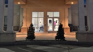 A building with a sign reading "RAMADA" at the entrance. - Ramada by Wyndham Estevan (Estevan)
