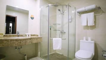 Combined shower/tub, free toiletries, hair dryer, slippers