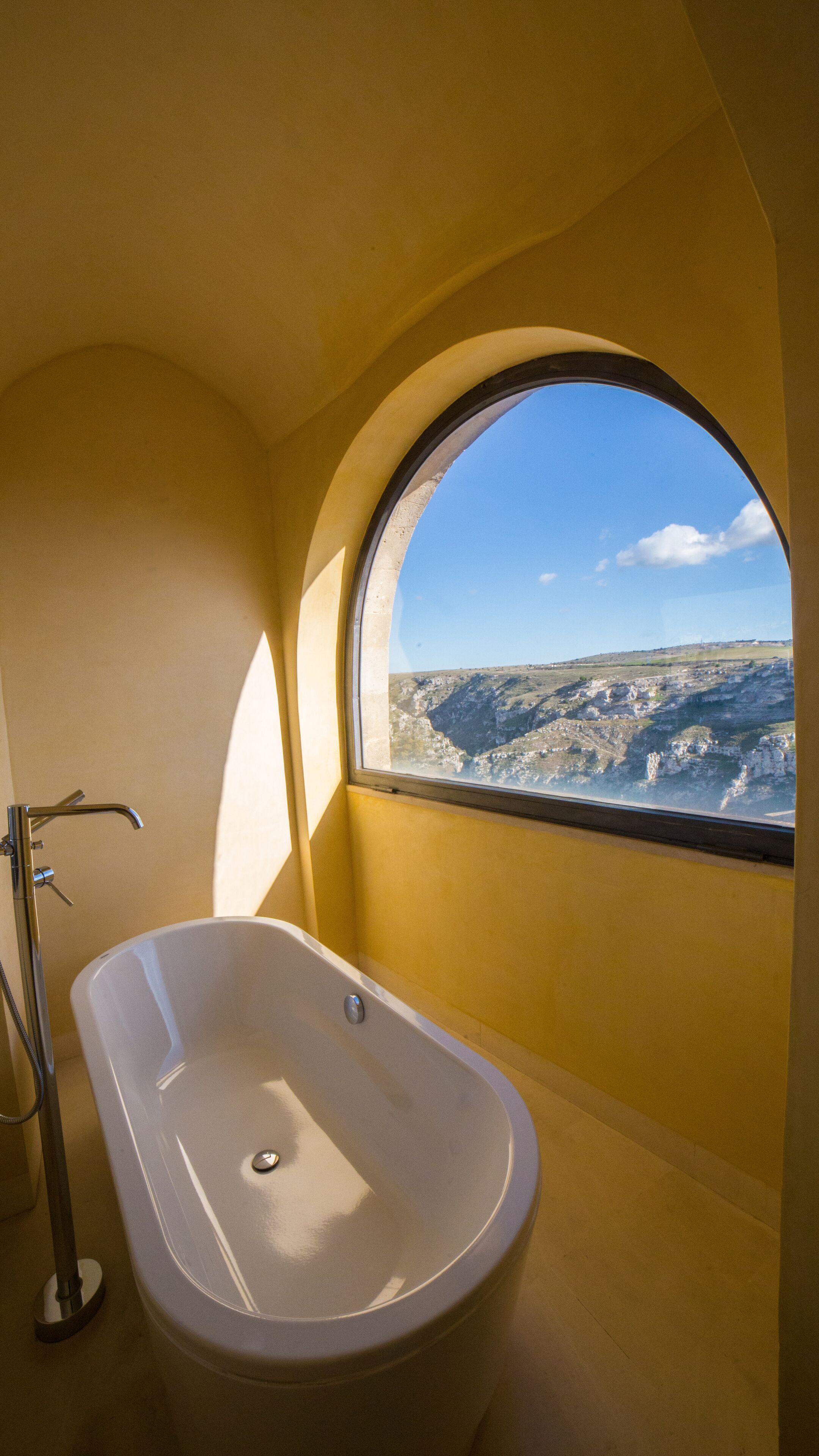 combined shower/bathtub, deep-soaking bathtub, rainfall showerhead