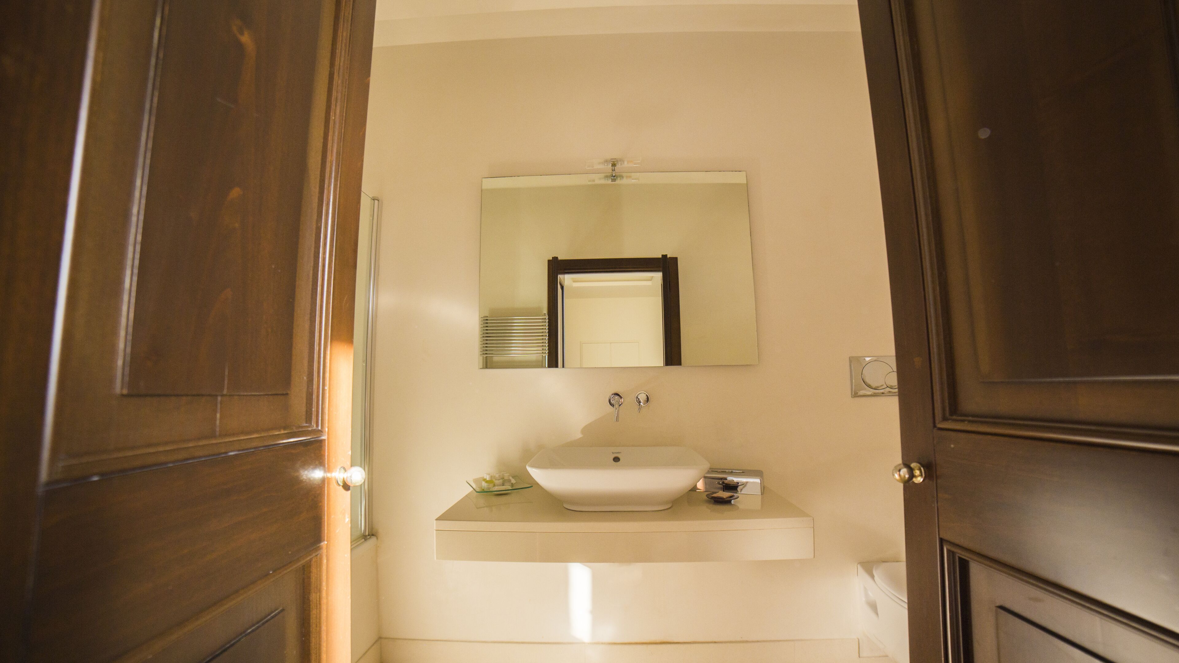 combined shower/bathtub, deep-soaking bathtub, rainfall showerhead