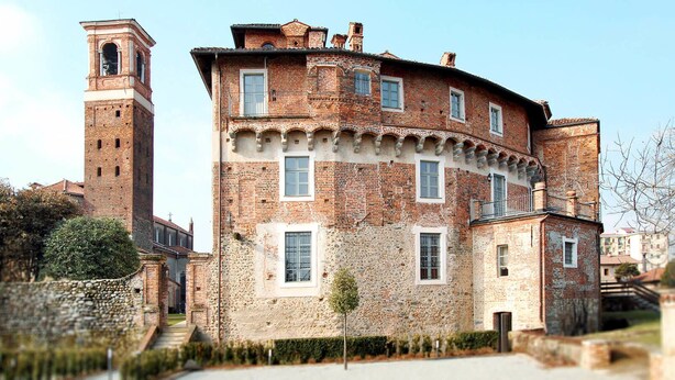 A historic building with a bell tower, multiple windows, and a stone facade. - Castello La Rocchetta (Sandigliano)