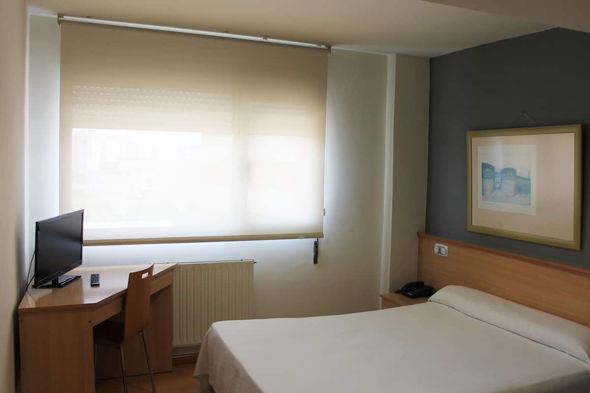 Desk, free WiFi, bed sheets