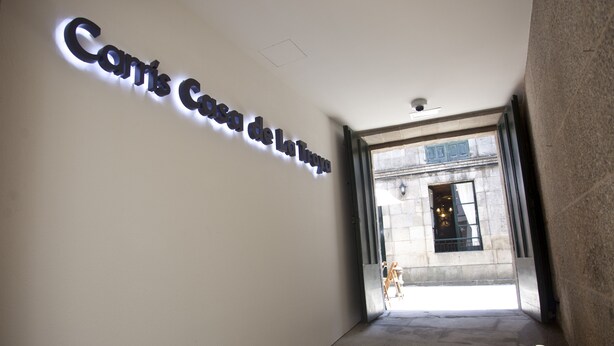 A corridor with a sign reading "Cory's Cafe de la Toya".