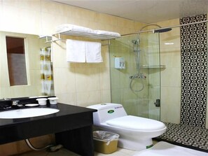 Combined shower/tub, free toiletries, hair dryer, slippers
