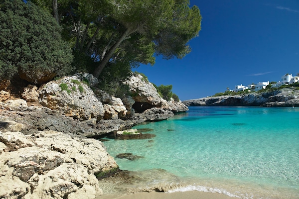 Beach nearby, white sand, beach umbrellas, beach towels
