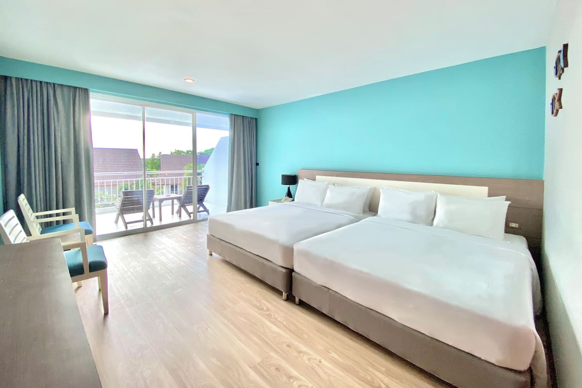 Family Poolview - 2 Queens | Minibar, in-room safe, desk, blackout drapes