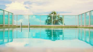 Indoor pool, outdoor pool, open 8 AM to 10 PM, pool umbrellas