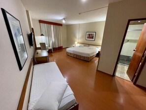 Superior Triple Room | Minibar, in-room safe, desk, laptop workspace