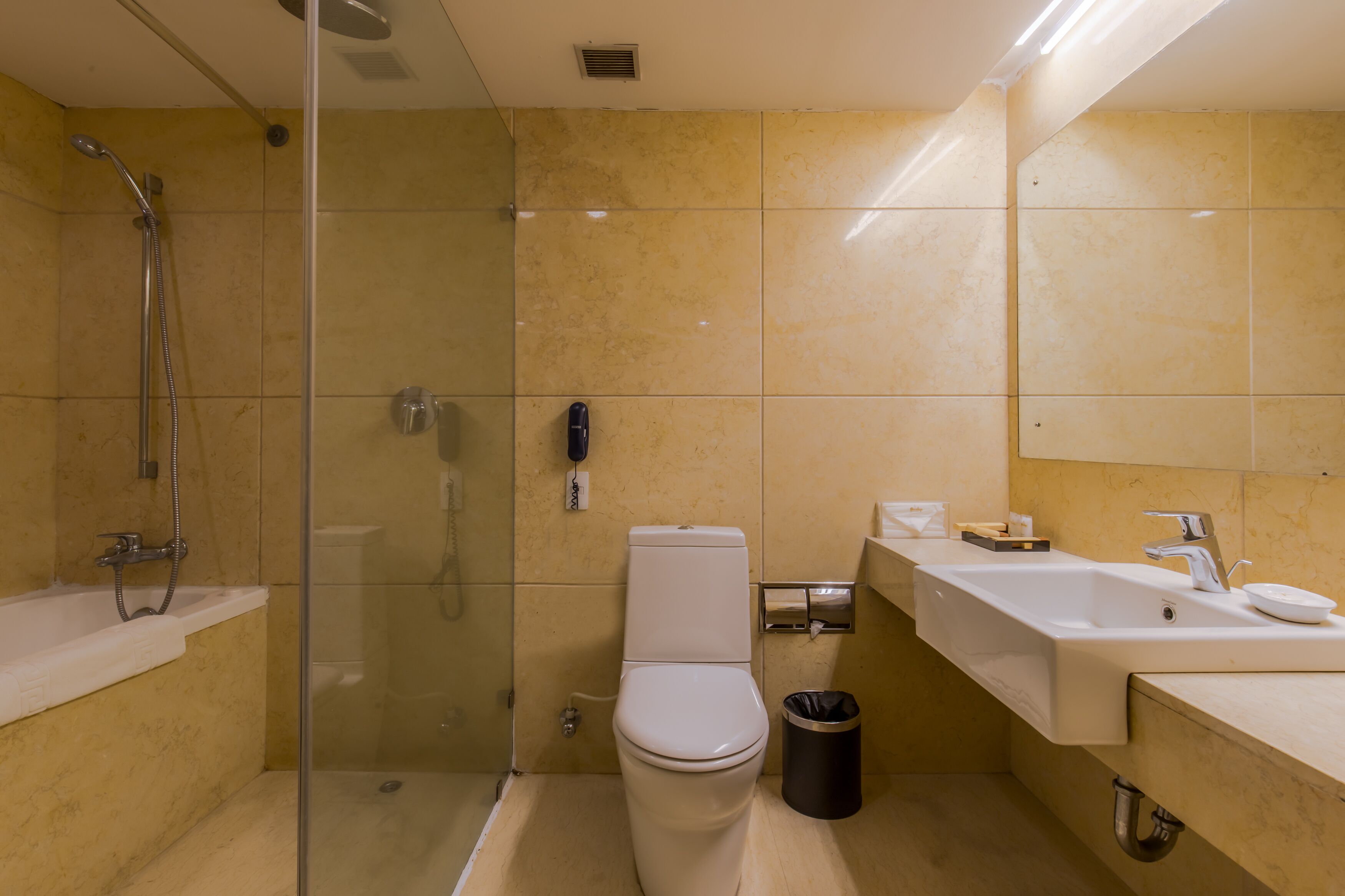 deluxe room, 1 bedroom, mountain view | bathroom | combined shower/bathtub, rainfall showerhead, designer toiletries