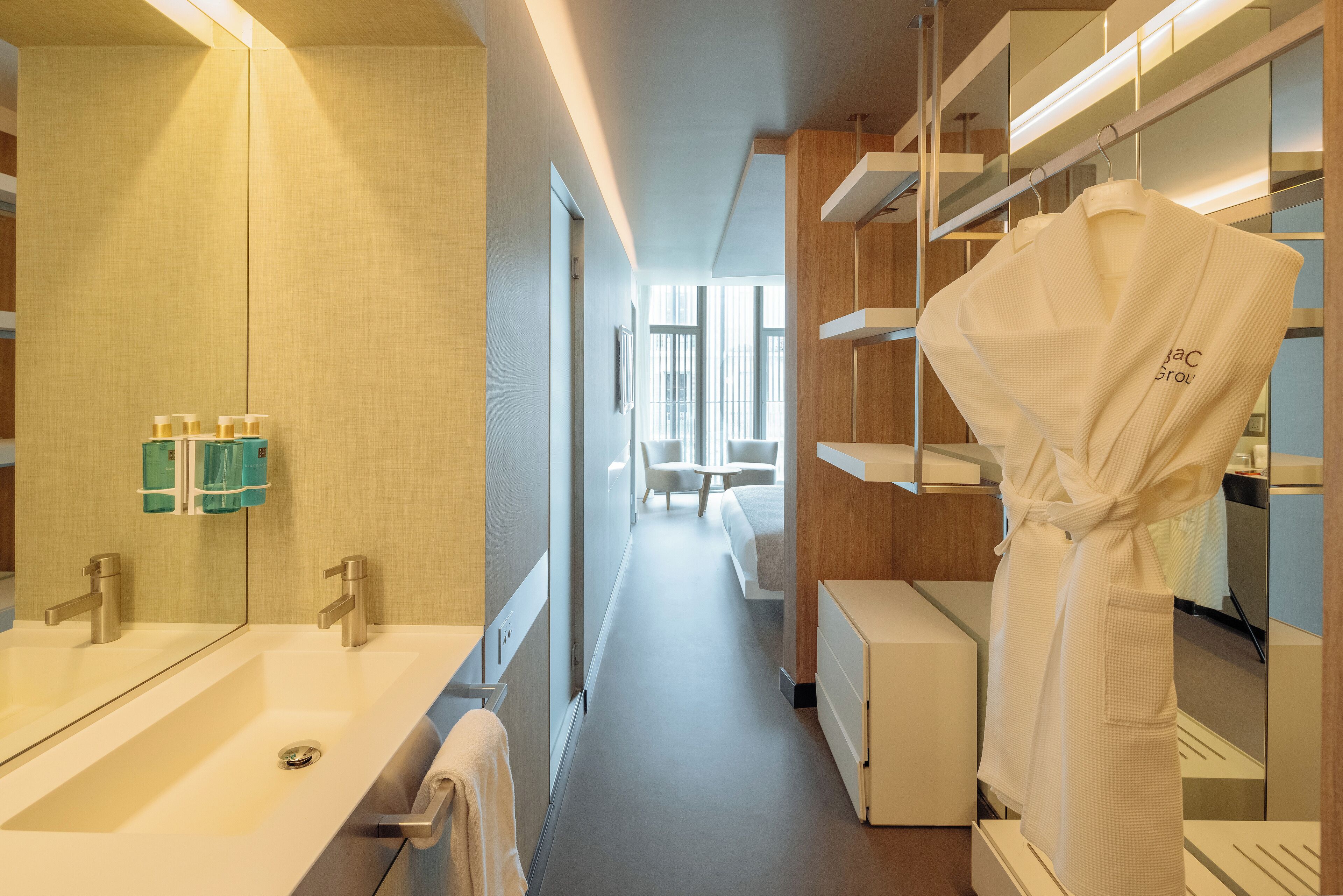 deluxe room | bathroom | shower, rainfall showerhead, designer toiletries, hair dryer