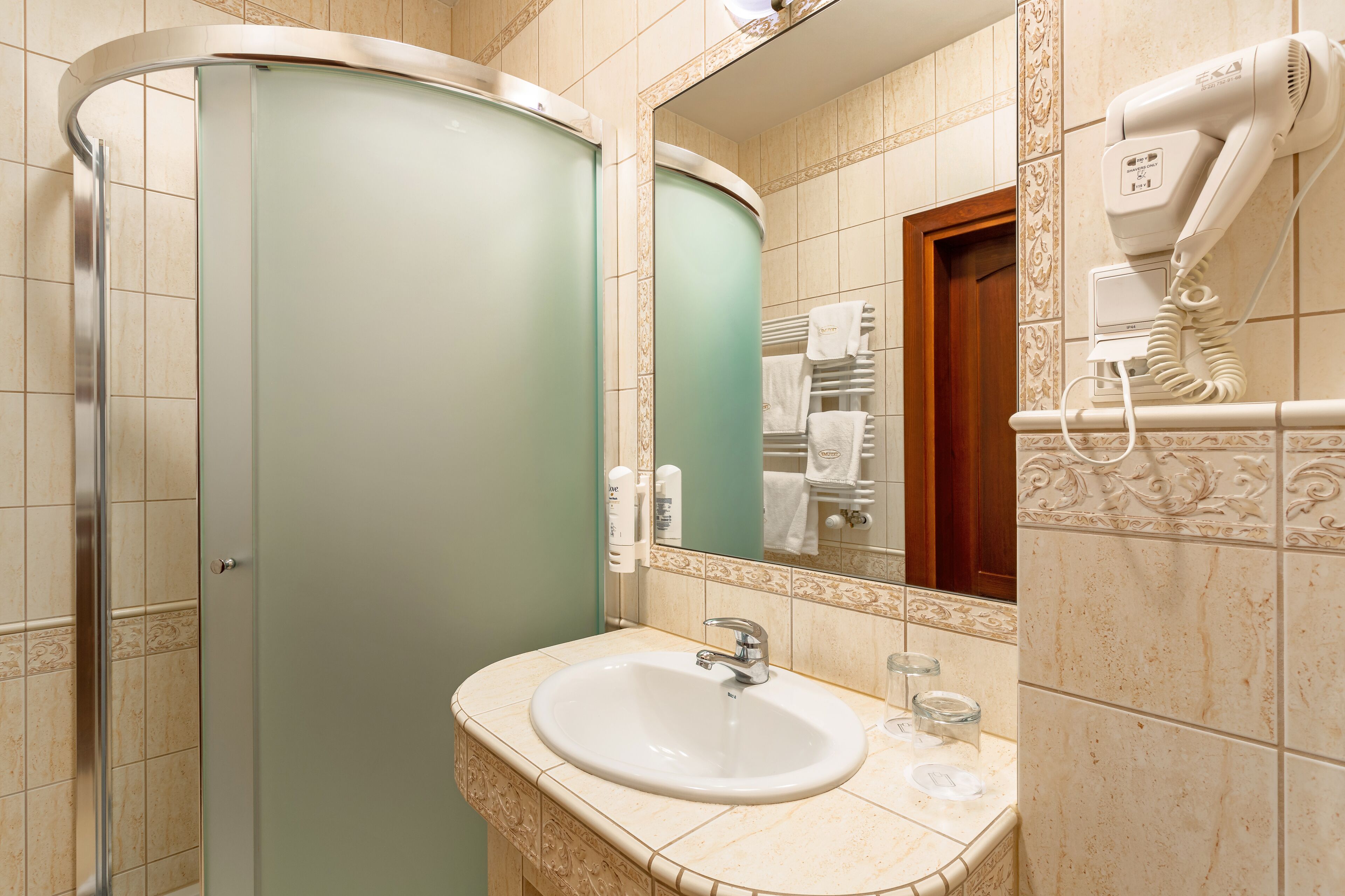 standard twin room | bathroom | shower, hair dryer, towels
