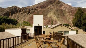 Enjoy the mountain view from our outdoor deck with seating.