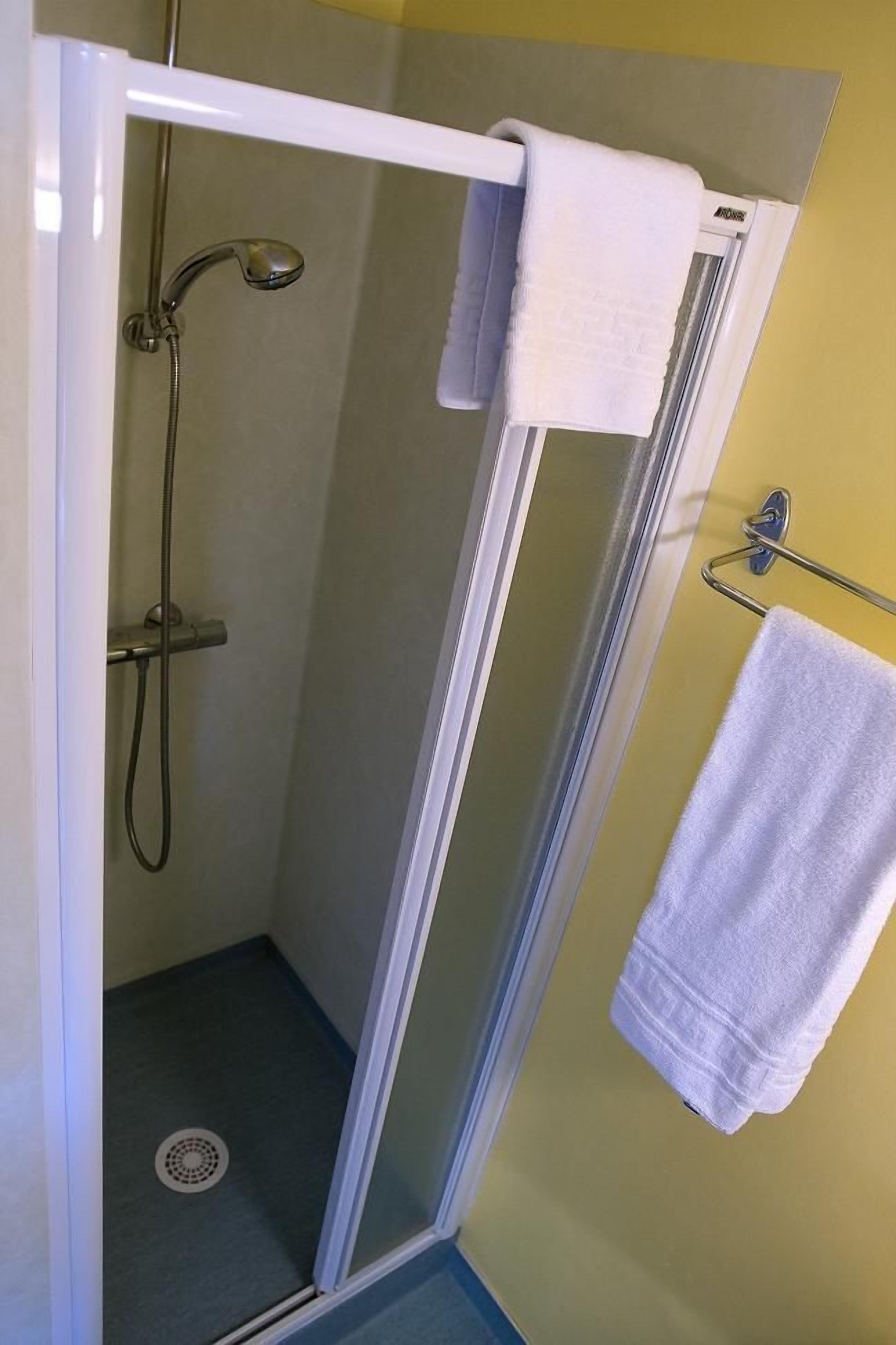 shower, free toiletries, hair dryer, towels