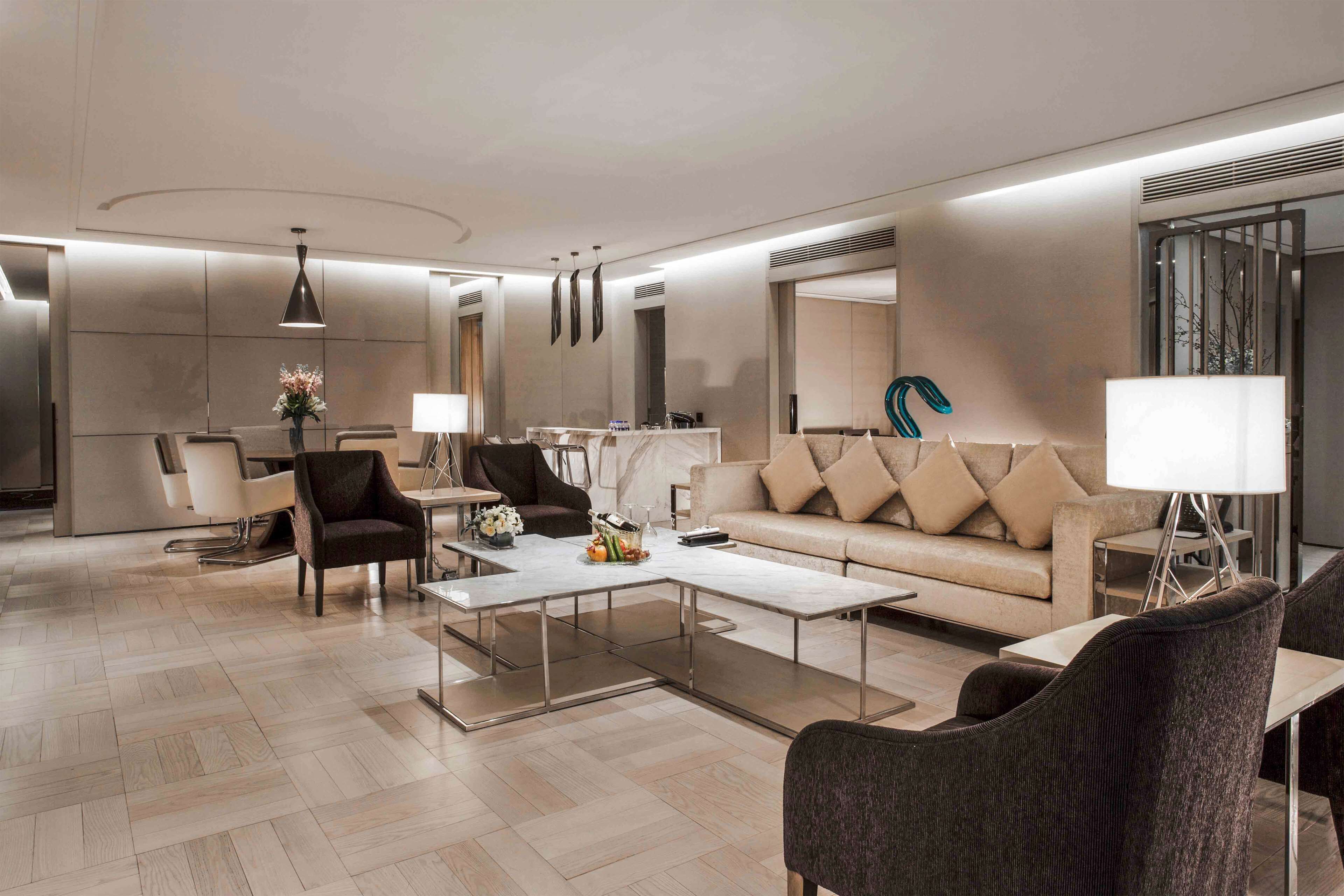 presidential suite, multiple beds | living area | 42-inch lcd tv with satellite channels, tv