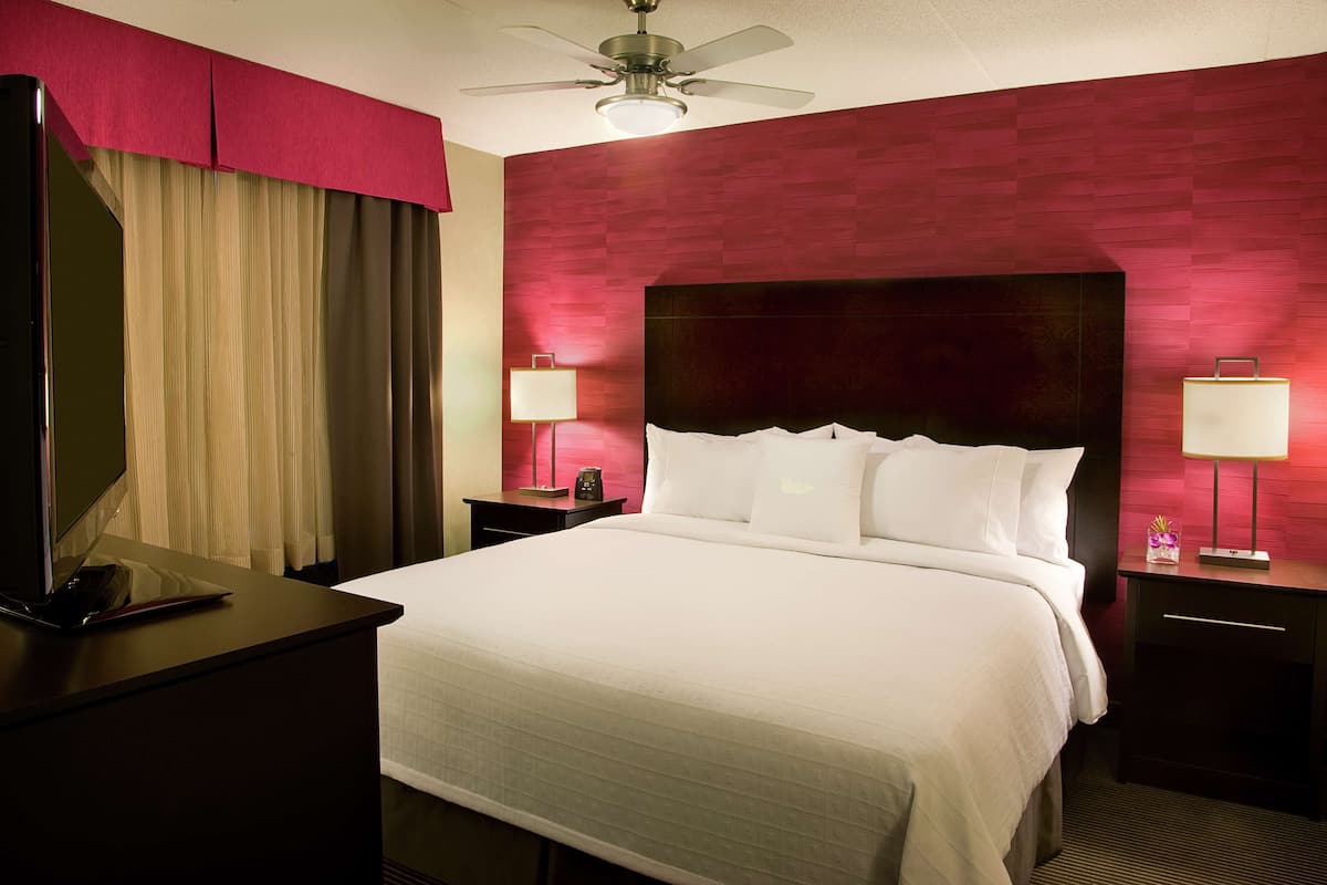 Hypo-allergenic bedding, down duvets, pillow-top beds, in-room safe