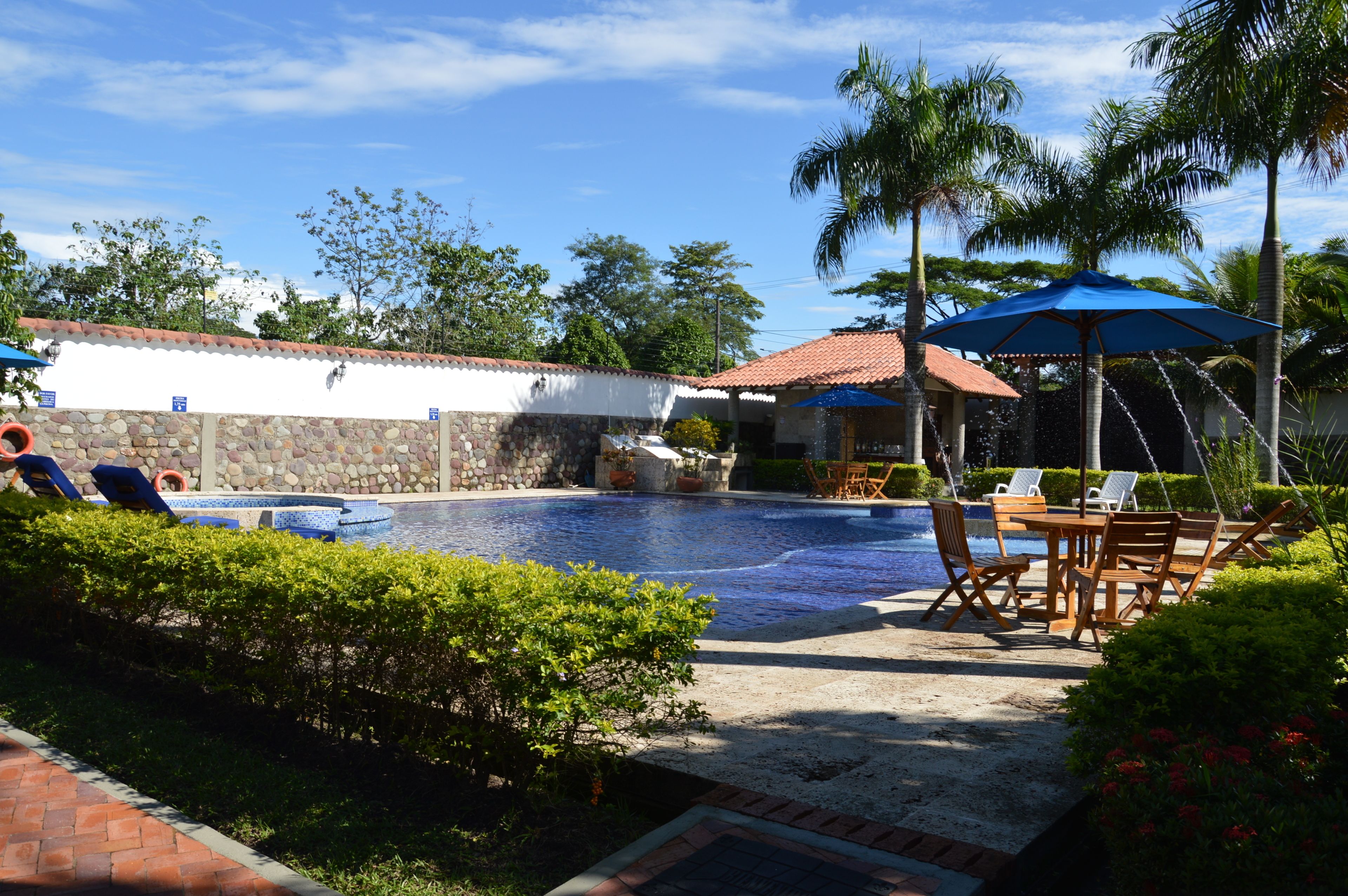Outdoor pool, pool umbrellas, sun loungers
