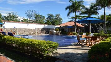 Outdoor pool, pool umbrellas, pool loungers