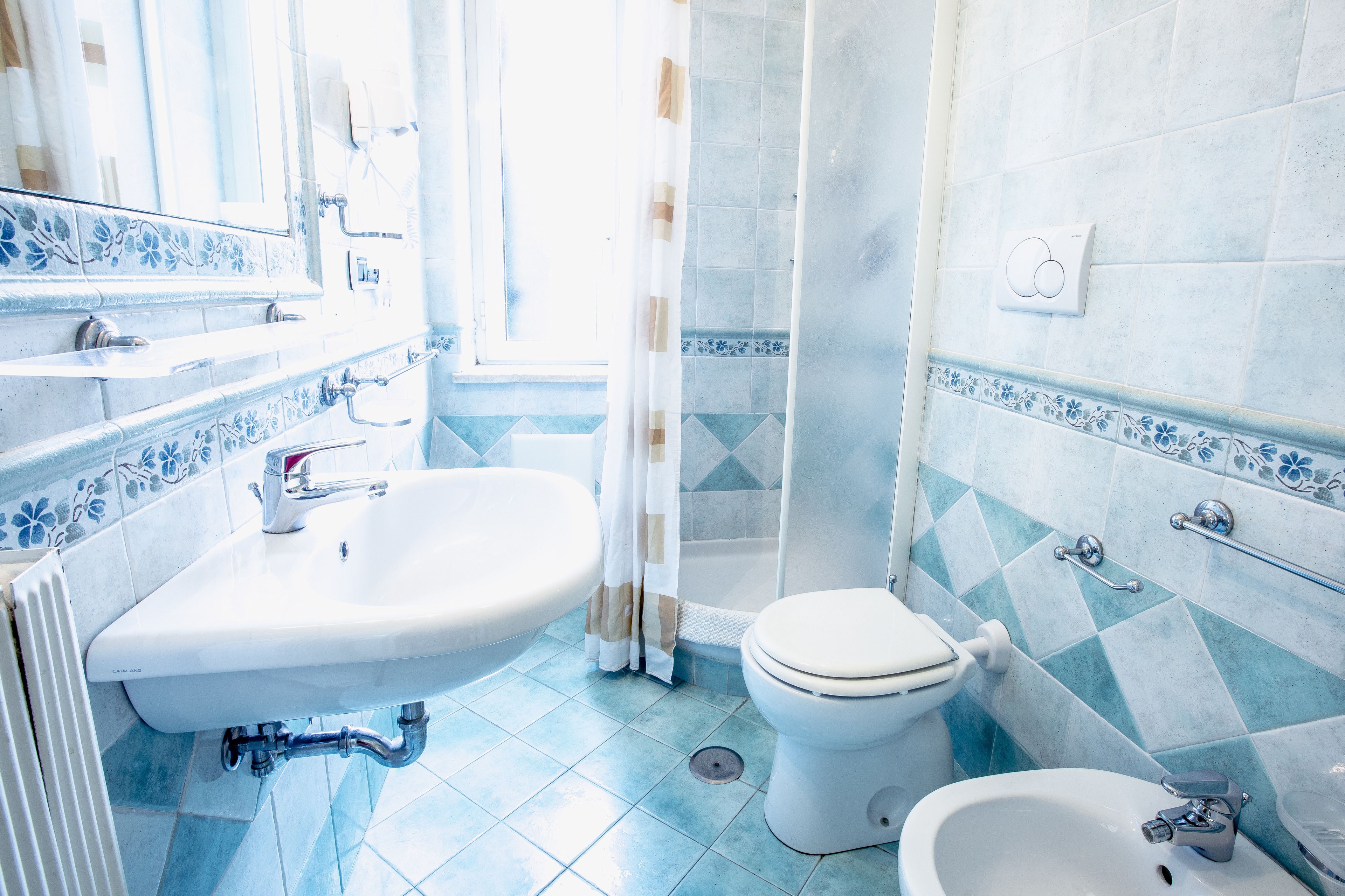 standard triple room | bathroom | rainfall showerhead, hair dryer, bidet, towels