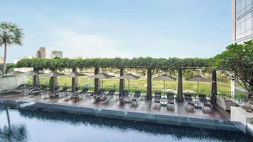 Outdoor pool, open 9:00 AM to 9:00 PM, pool umbrellas, pool loungers