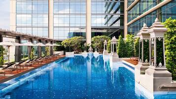 Outdoor pool, open 9:00 AM to 9:00 PM, pool umbrellas, pool loungers