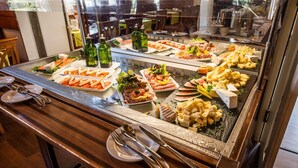 A buffet with various food items and utensils. - Waldhaus Jakob (Konstanz)