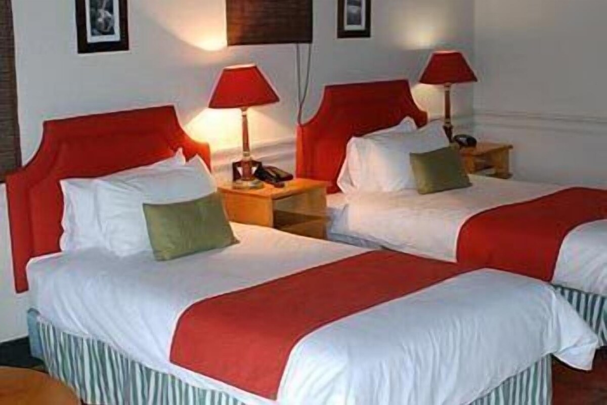 Standard Twin Room | Down duvets, minibar, in-room safe, individually decorated