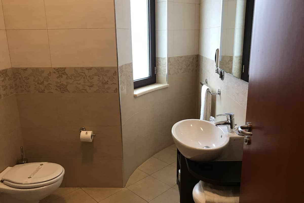 junior studio suite | bathroom | shower, designer toiletries, hair dryer, bidet