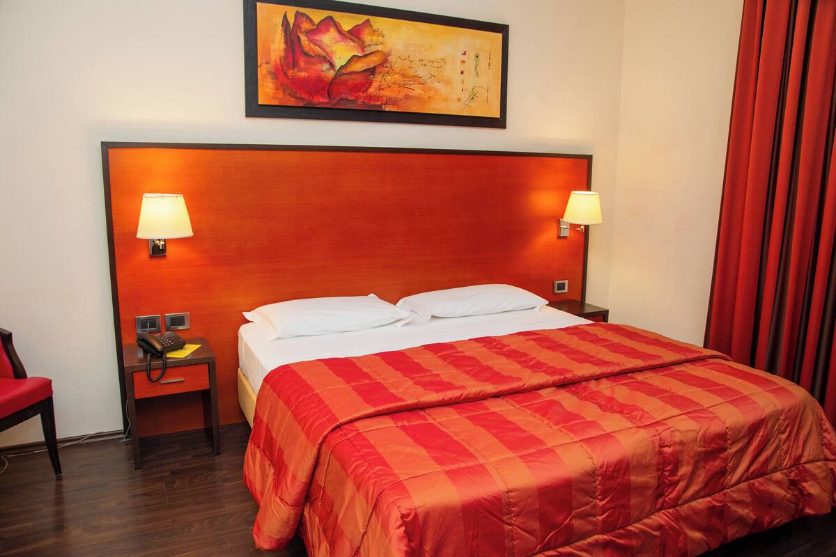 Premium bedding, down comforters, minibar, in-room safe