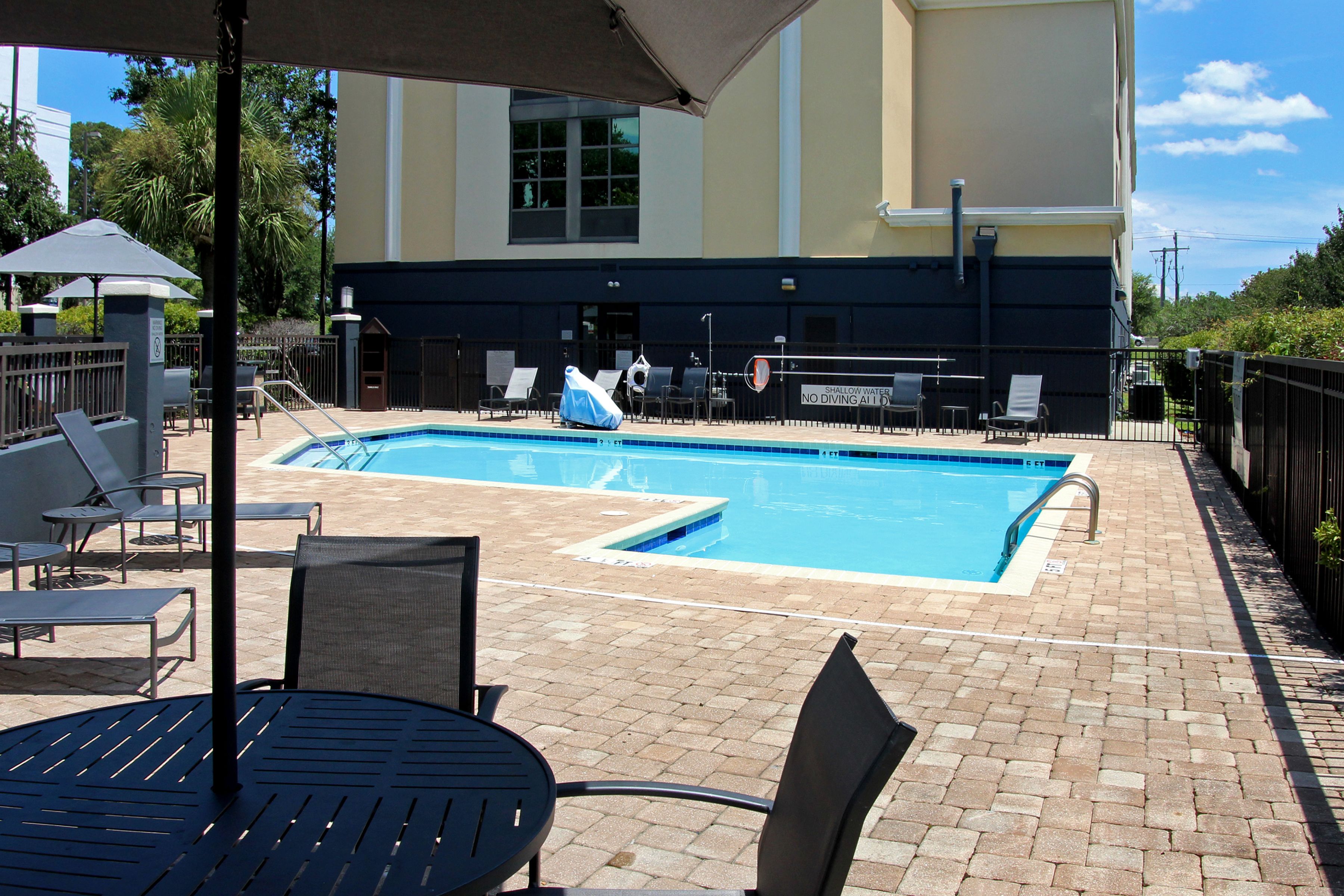 outdoor pool, pool umbrellas, pool loungers