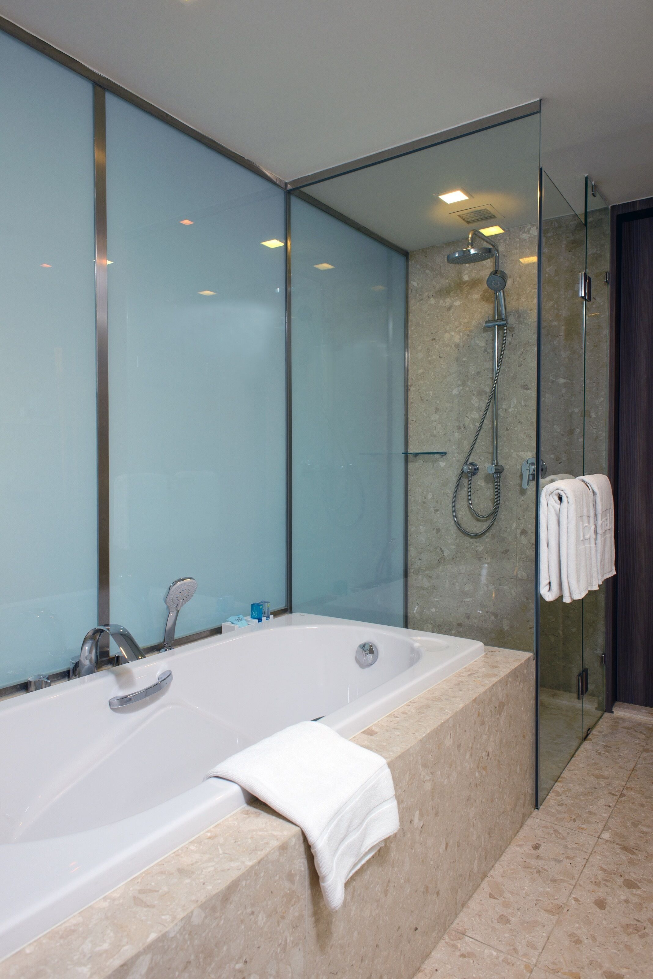 premier suite, 1 king bed | bathroom | shower, eco-friendly toiletries, hair dryer, bathrobes