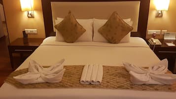 Colchones con pillow-top, minibar y caja de seguridad en la habitación