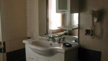 Bathtub, hair dryer, towels