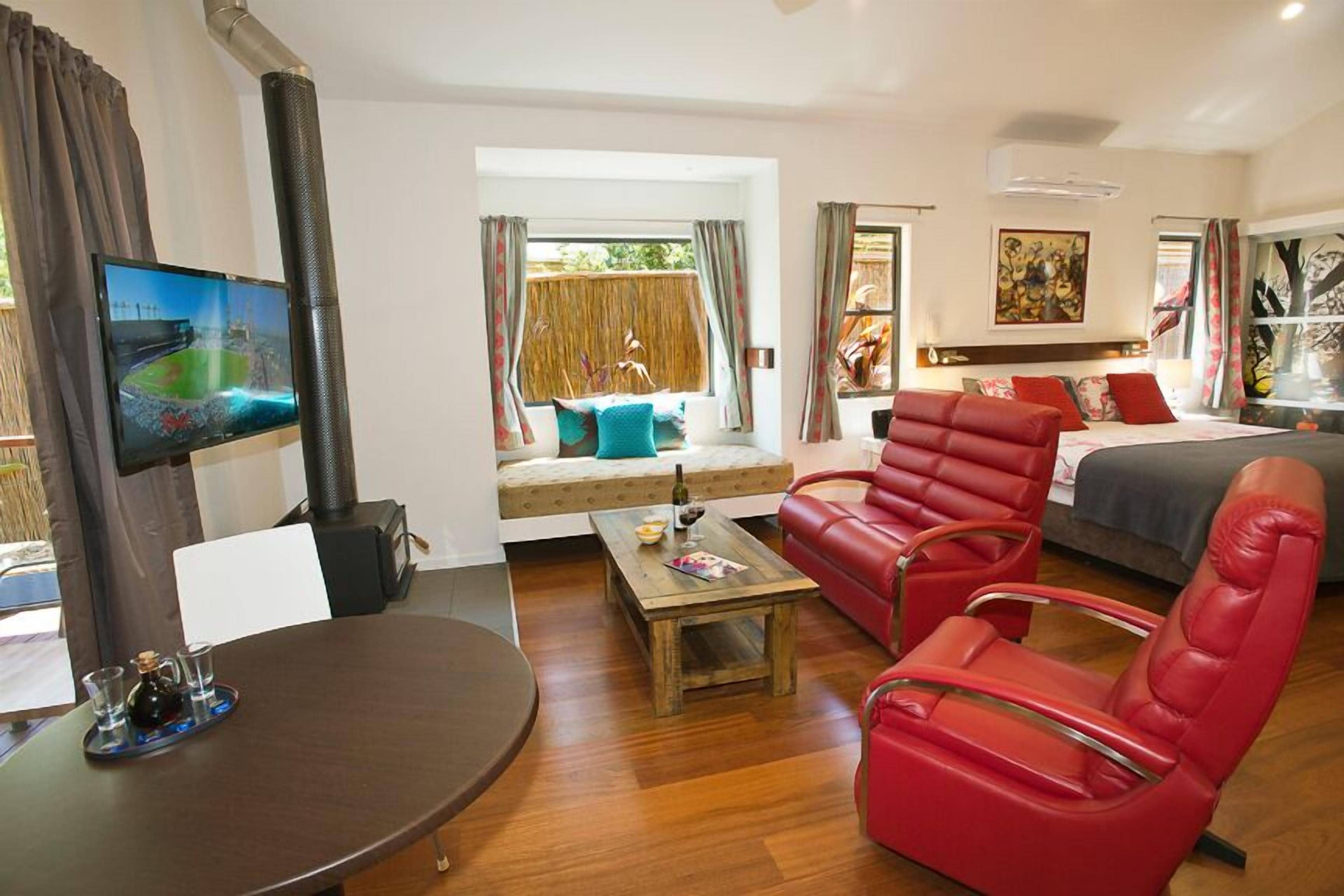 Premium Suite | Living area | TV, fireplace, DVD player