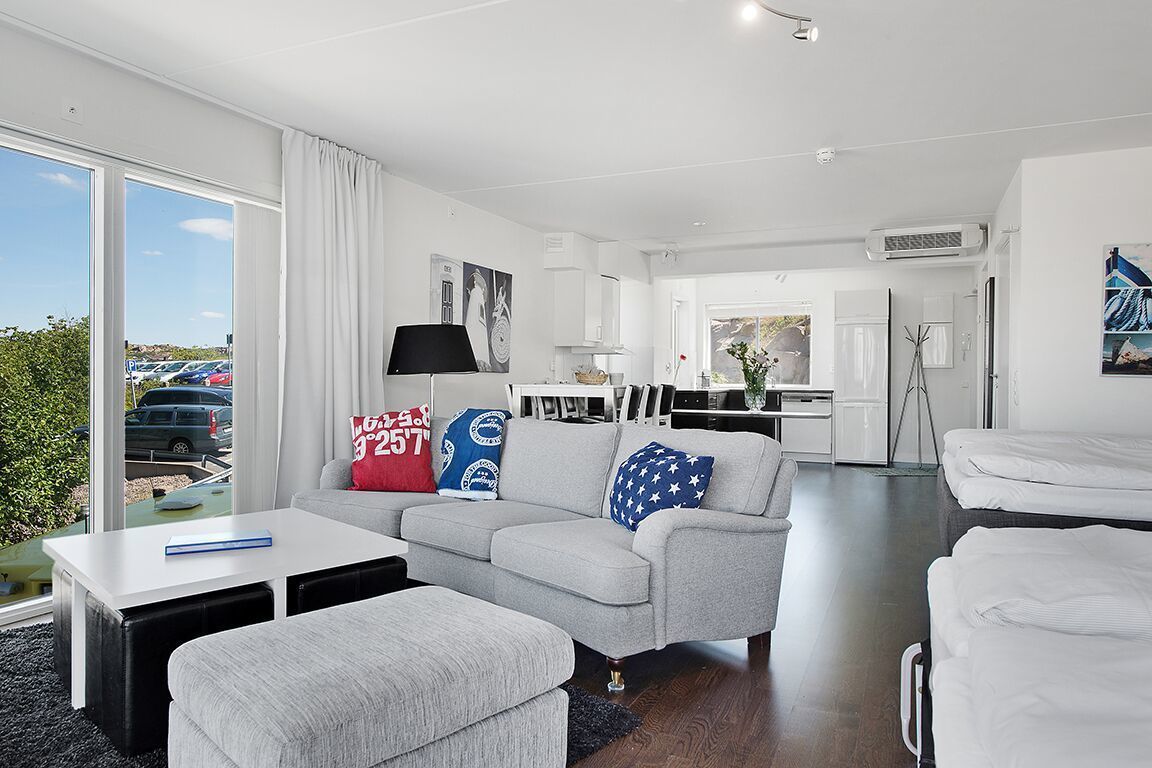 standard studio, partial sea view (main building) | living area | flat-screen tv