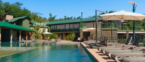 Outdoor pool, pool umbrellas, sun loungers