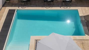 Seasonal outdoor pool, pool loungers