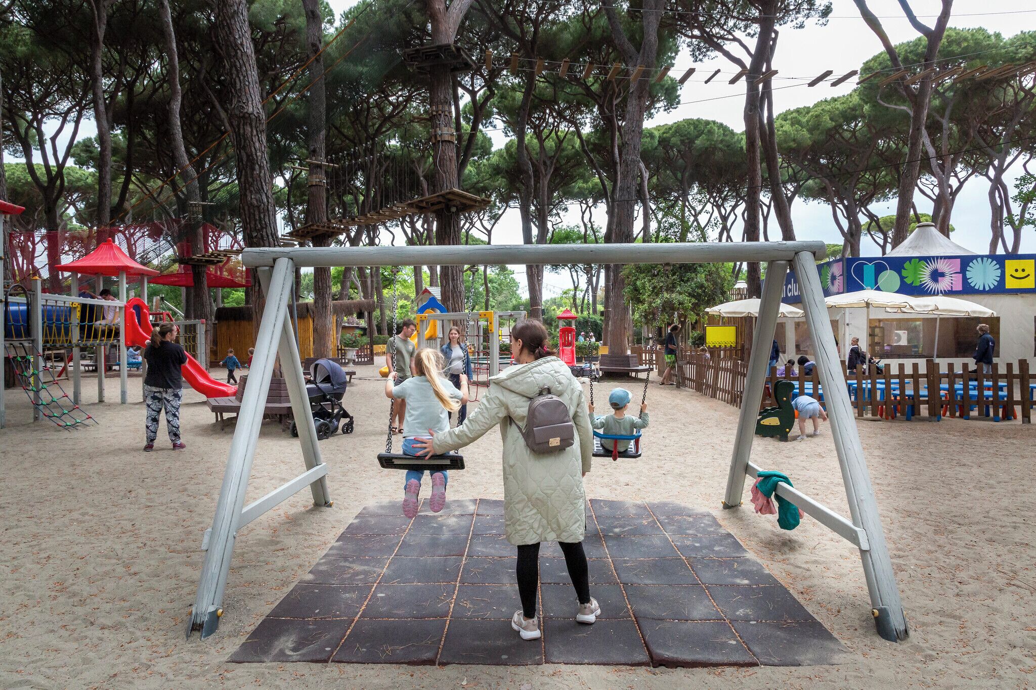 A playground with swings and a slide.