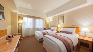 A hotel room with two beds, a desk with a vase of flowers, and a large window with curtains. - Cosmos Hotel Taipei (Taipei)