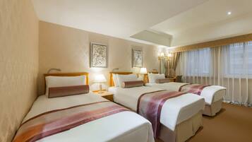 Down duvets, pillow-top beds, in-room safe, desk