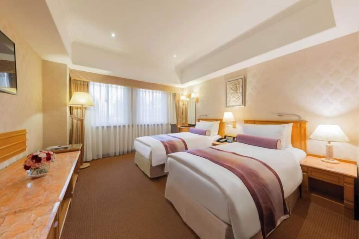 Down duvets, pillow-top beds, in-room safe, desk