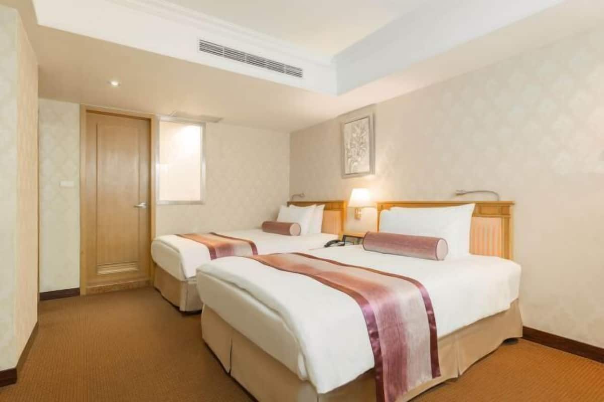 Down duvets, pillow-top beds, in-room safe, desk