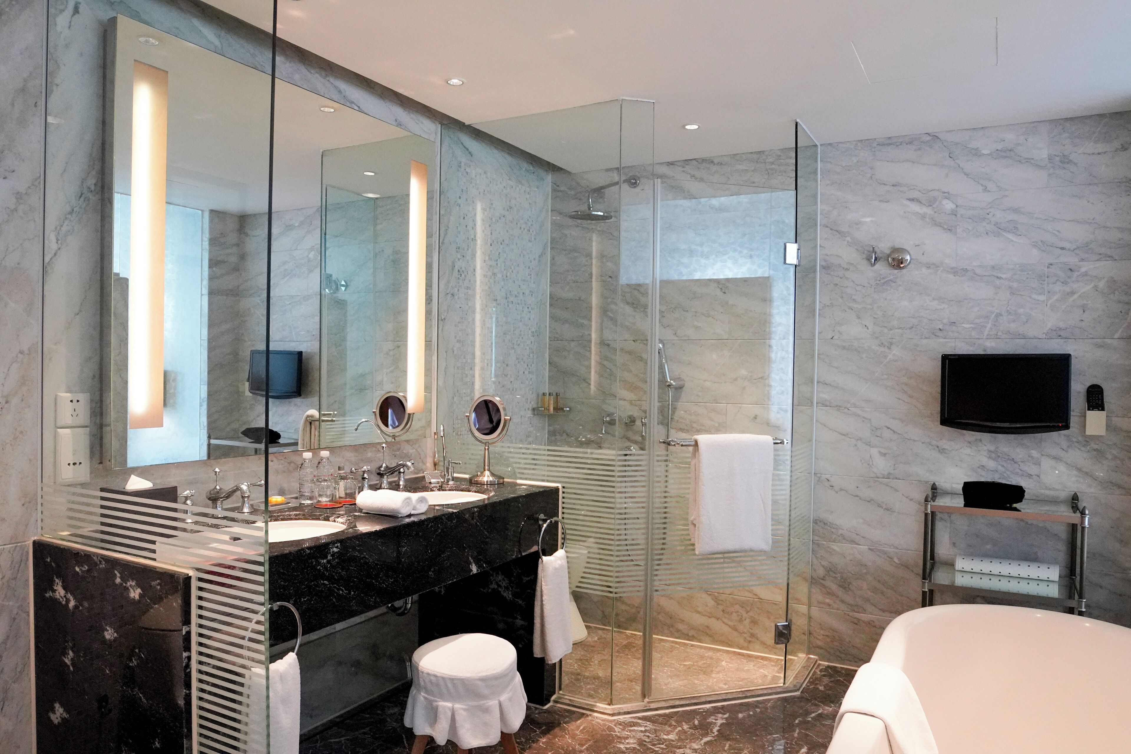 deluxe twin | bathroom | separate bathtub and shower, deep-soaking bathtub, rainfall showerhead