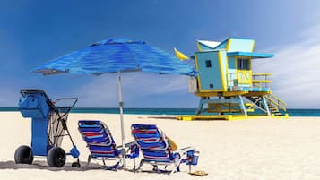 On the beach, sun loungers, beach umbrellas, beach towels