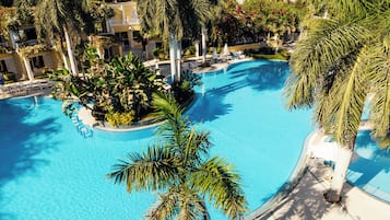 Indoor pool, outdoor pool, pool umbrellas, pool loungers