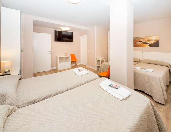 Quadruple Room, Private Bathroom | 1 bedroom, down comforters, free WiFi, bed sheets